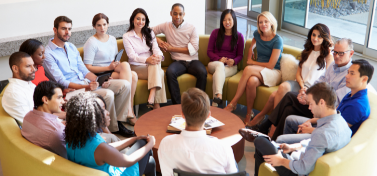 Staff in a circle meeting