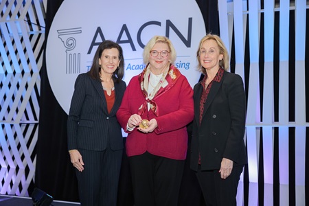 2026 John P. McGovern Lectureship Award photo with AACN President and CEO Deborah Trautman, John P. McGovern Lectureship Award Winner, Betty Ferrell, and AACN Board Chair Julie Sanford
